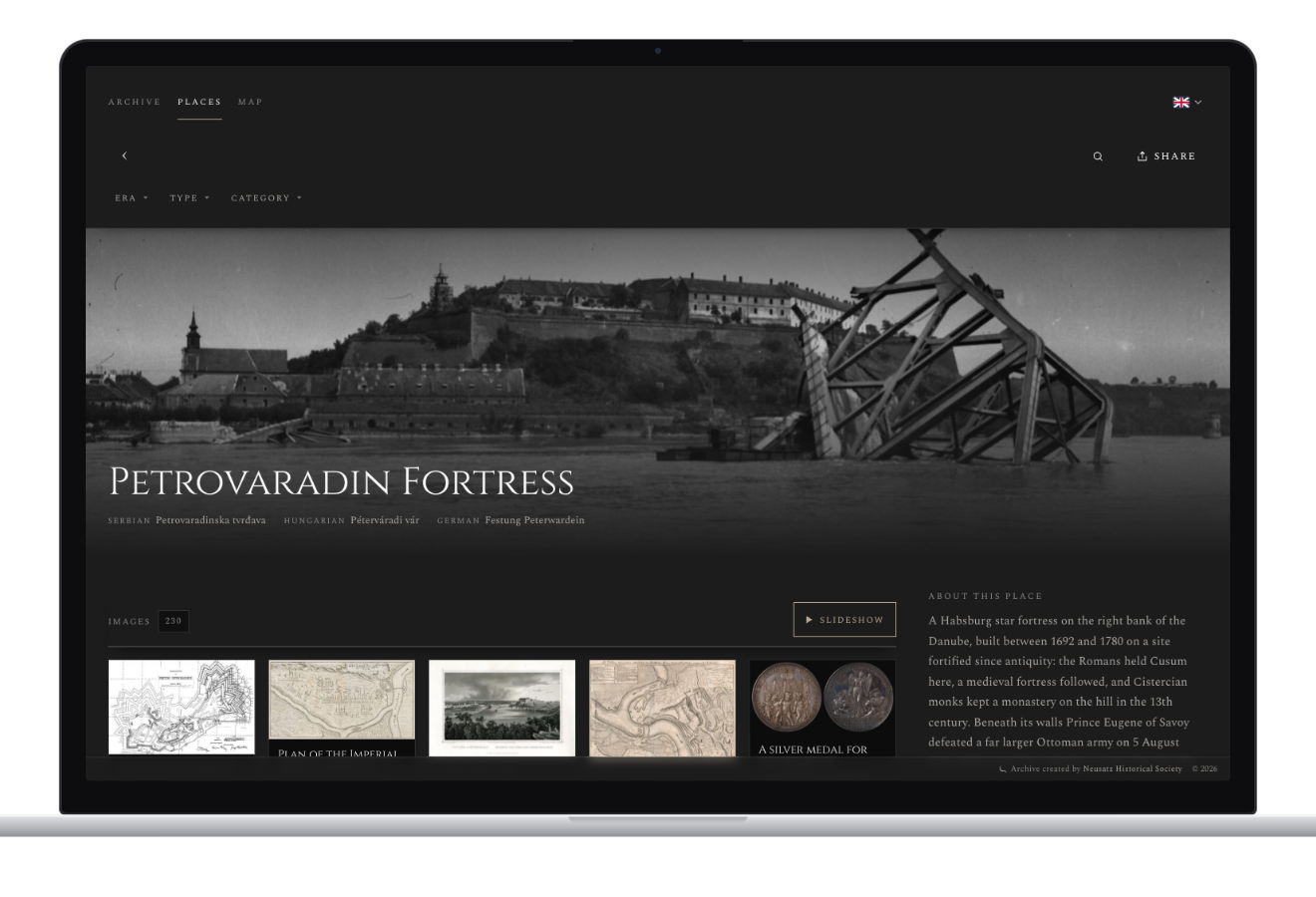 The Petrovaradin Fortress place page on a laptop: a wide header photograph of the fortress above the Danube, with its names in Serbian, Hungarian and German